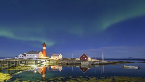 Lighthouse on the coast with aurora Stock Footage 250300412