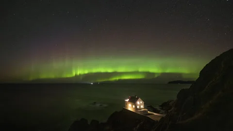 Lighthouse on coast with aurora Stock Footage 266915224