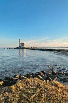 The Lighthouse for the coast of Marken, The Netherlands. Stock Photos