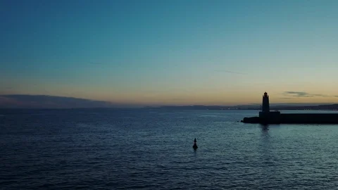 Lighthouse On The Coast At The Sea . Evening. Stock-Footage 111526563