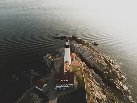 A lighthouse at the coast of the sea Stock Photos