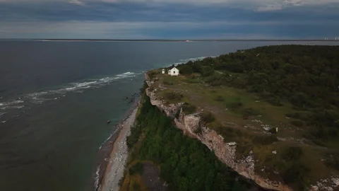 Lighthouse Cottage on High Sea Cliffs on Gotland, Sweden at Dusk Stock Footage 340385815