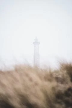 Lighthouse covered in Fog Foto stock