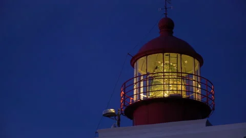 Lighthouse with dark blue sky in the background at dusk Stock Footage 146648450