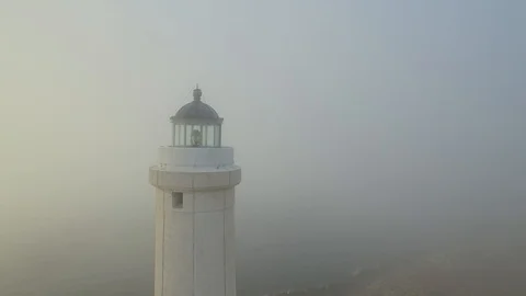 Lighthouse at dawn - aerial view 4k Stock Footage 86429632
