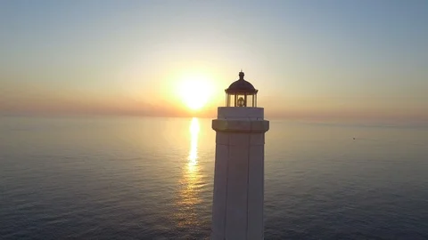 Lighthouse at dawn - aerial view 4k Stock Footage 86579409