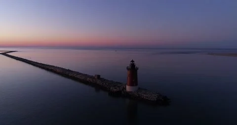 Lighthouse on the Delaware Bay during sunrise over the Atlantic Ocean Stock Footage 143206911