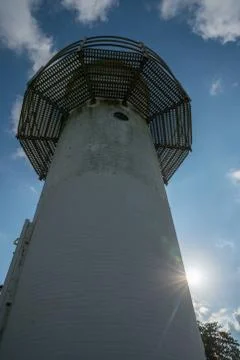 Lighthouse from a different perspective wtih blue sky Stock Photos