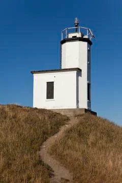 Lighthouse with dirt path Stock Photos