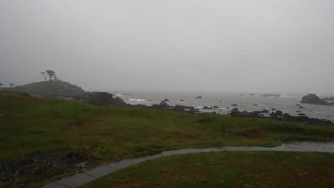 Lighthouse in the distance, ocean, raining Stock Footage 81142178