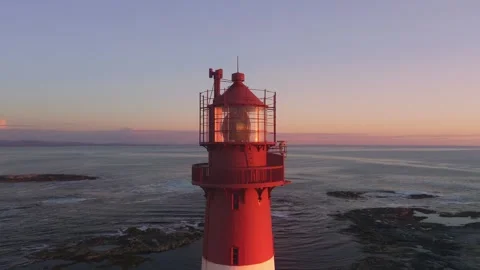 Lighthouse Drone Orbit at Sunset With Reflections, Norway Stock Footage 317322318