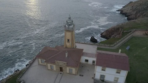 Lighthouse drone view during sunset in Asturias, Spain Stock Footage 111980549