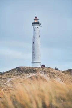 Lighthouse on the Dunes of Denmark Stock Photos
