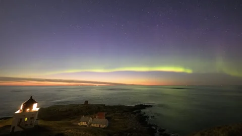 Lighthouse during a moonlit night with the aurora borealis Stock Footage 250427292