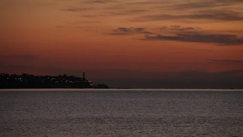 A Lighthouse during red sunset, near the Ocean, Spain, Malaga Stock Footage 86871864