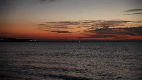 A Lighthouse during red sunset, near the Ocean, Spain, Malaga Stock Footage 86874199
