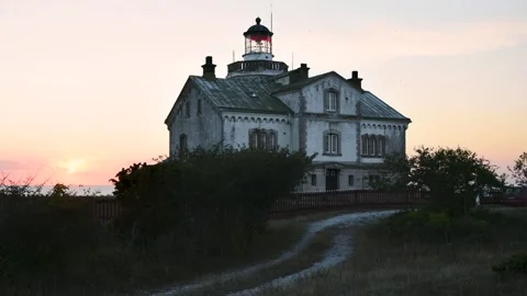 Lighthouse at Dusk with Road Leading In Stora Karlsö Sweden Stock Footage 331553948