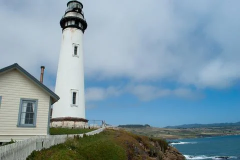 Lighthouse at the edge of the beach Stock Photos