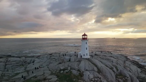 Lighthouse Edge Ocean Lit By Sunset Captured In Motion From Drone In Nova Scotia Stock Footage 314465021