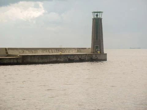 Lighthouse at the edge of the pier Stock Photos