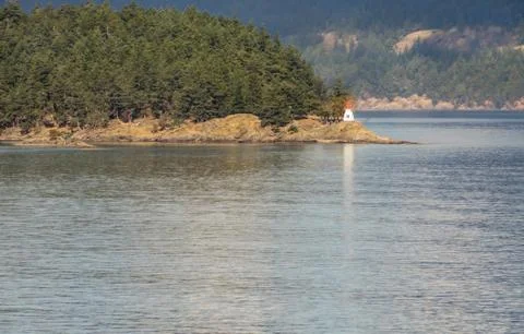 Lighthouse at the end of an island Stock Photos