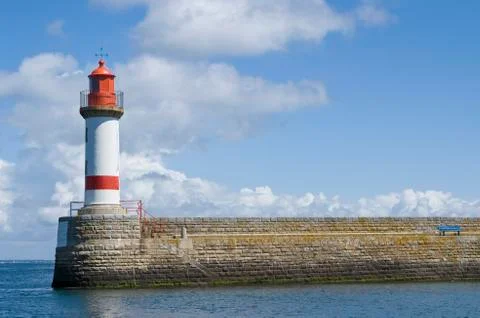 Lighthouse at the end of the pier Stock Photos