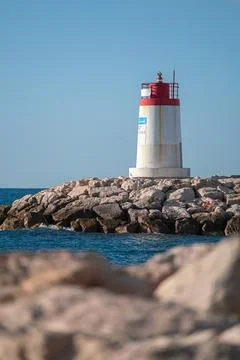 Lighthouse at the end of a pier Stock Photos