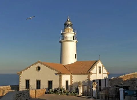 Lighthouse far de capdepera, daytime, sunny blue sky with seagull, cala ratja Stock Photos