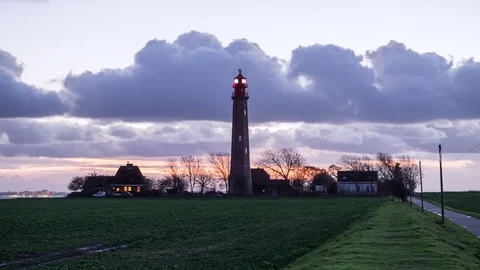 Lighthouse Fehmarn at night clouds moving by timel-apse Stock Footage 82737746