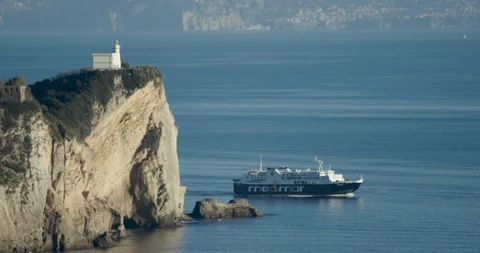 Lighthouse with ferry boat Stock Footage 128377882