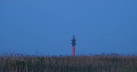 Lighthouse in field Stock Footage 139132311