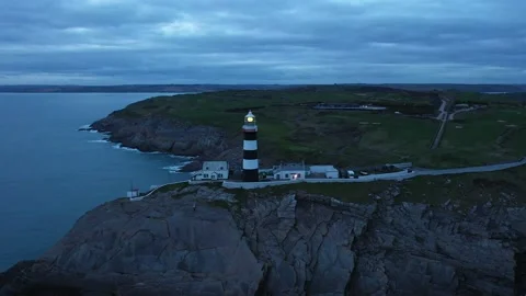 Lighthouse is flashing. Old Head Lighthouse, West Cork, Ireland 4K Stock Footage 234143795