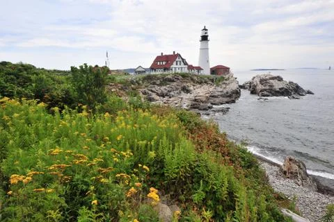 Lighthouse with flowers Stock Photos