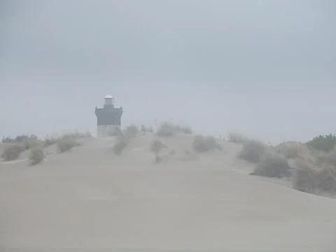 Lighthouse in the fog Stock Photos