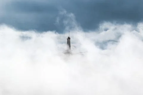 Lighthouse in the fog 스톡 사진