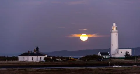 Lighthouse with Full Moon Stock Photos