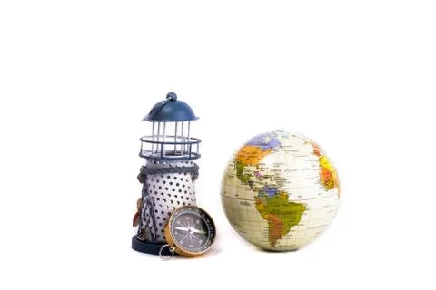 Lighthouse, globe and compass Stock-Fotos