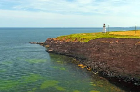 Lighthouse Guarding a Remote Coast Photos