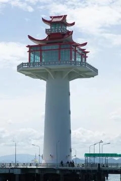 Lighthouse in the harbor. Stock Photos