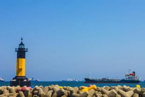 Lighthouse in the harbor. Stock Photos