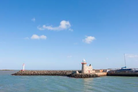 Lighthouse at the harbour Stock Photos