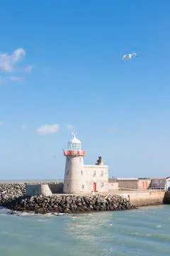 Lighthouse at the harbour Stock Photos