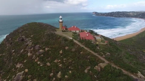 Lighthouse On Headland Stock Footage 71318404