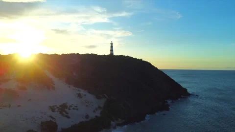 Lighthouse is on a hill overlooking the ocean Video stock 294547487