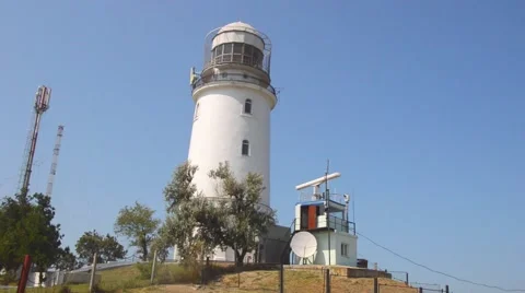 The lighthouse on the hill with the radar station Stock Footage 54928399