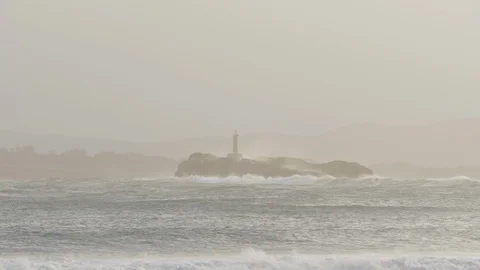 Lighthouse hit by big waves in Cantabria, Spain Stock Footage 112433158