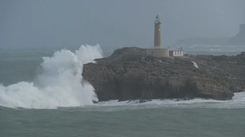 Lighthouse hit by huge waves in Spain Stock Footage 112434184