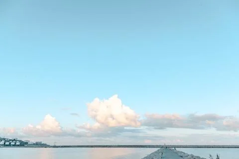 Lighthouse on the horizon Stock Photos