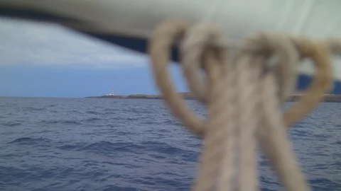 Lighthouse indicates Direction  Sheet weighs on bow pullpit Stock Footage 113385816