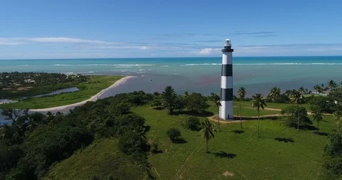 Lighthouse int eh beach drone Stock Footage 91984392